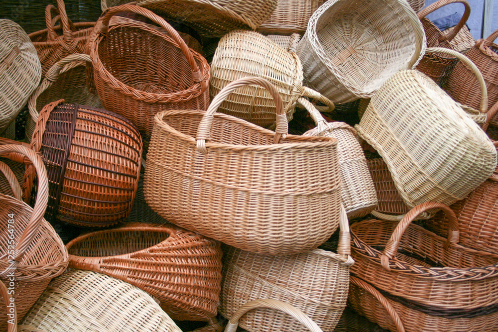 Group of empty wicker baskets for sale in a market place