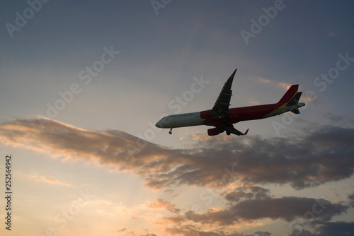  plane at sunset is landing