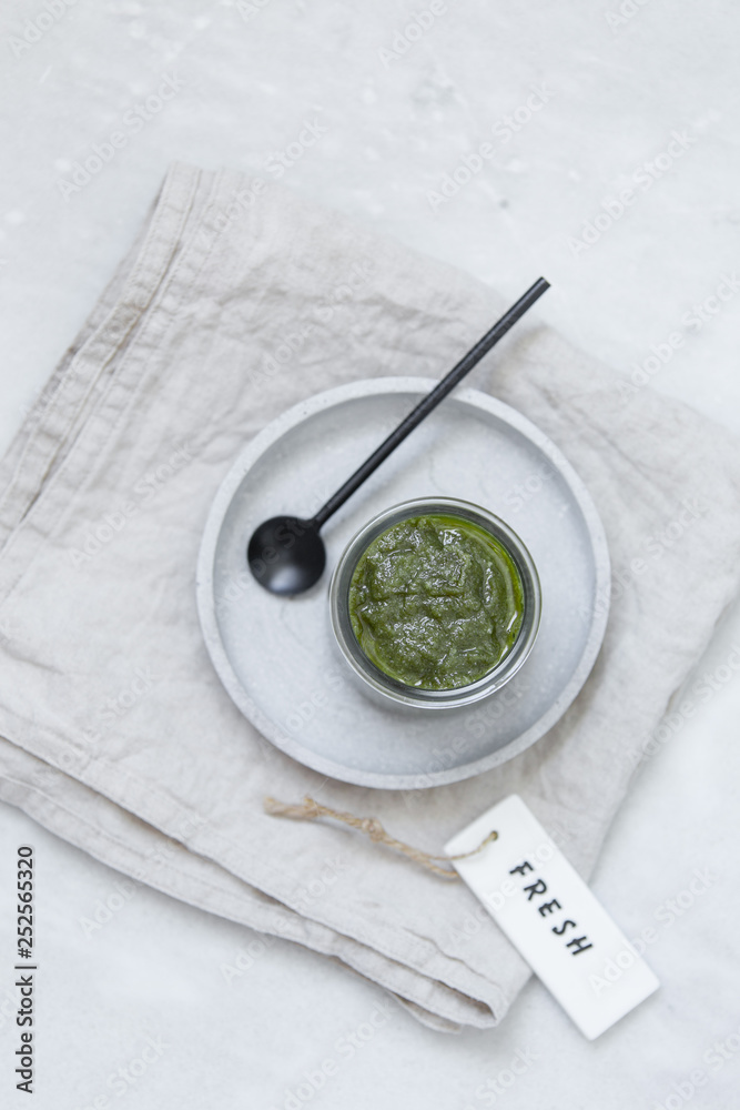 fresh pesto in bowl on marble texture background with copy space fresh pesto in bowl on marble texture background with copy space