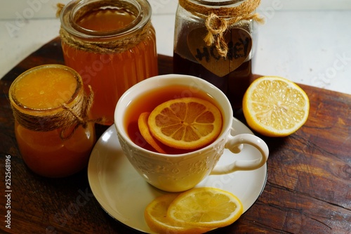 Hot tea with spices, honey and syrup - an alternative to antibiotics - selective focus