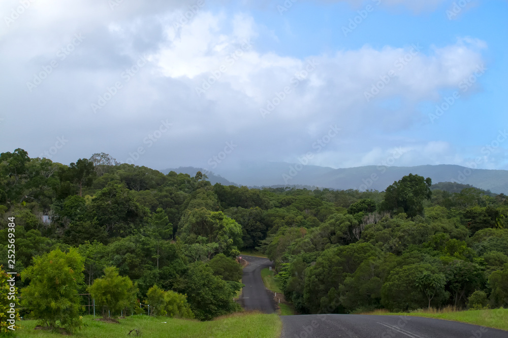 Rain falling on a rainforest landscape near Kuranda in Tropical North Queensland, Australia