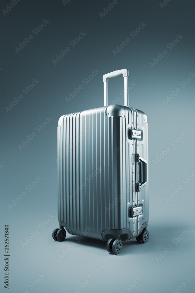 close up view of nice metal wheeled suitcase on blue background close up view of nice metal wheeled suitcase on blue background