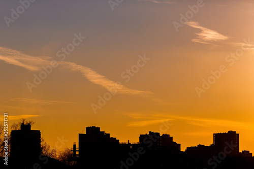 High rise building silhouette in yellow background. Urban concept © korsarid