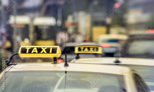 Taxis drive in the traffic of a big city