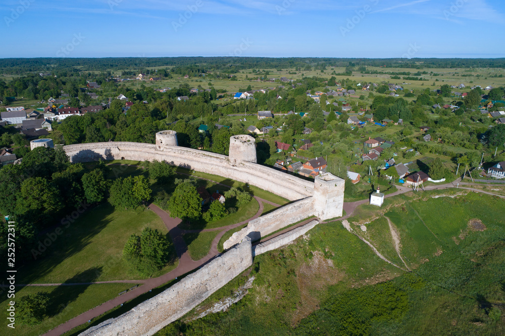 View of the towers of the Izborsk fortress on a sunny June day. Old Izborsk, Russia