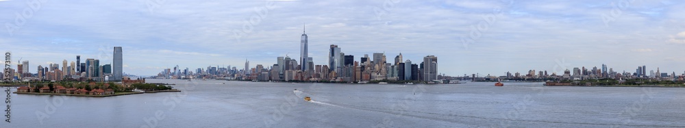 Panorama view of New York City Skyline with skyscrapers and Ellis Island. Manhattan view from Liberty Island..