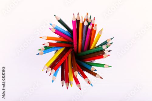Colored pencils, school supplies for drawing, pattern, copy space.