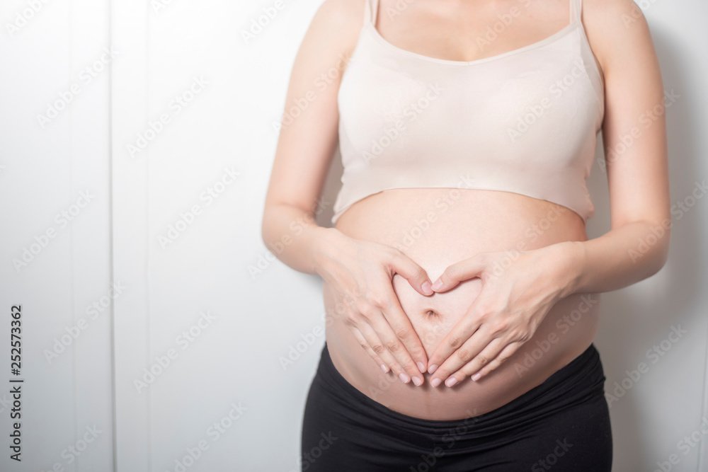 Close up pregnant woman expecting a baby Close up pregnant woman expecting a baby