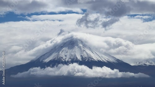 Time Lapse of the Licancabur volcano with snow and clouds covering it. Atacama Desert, Chile photo