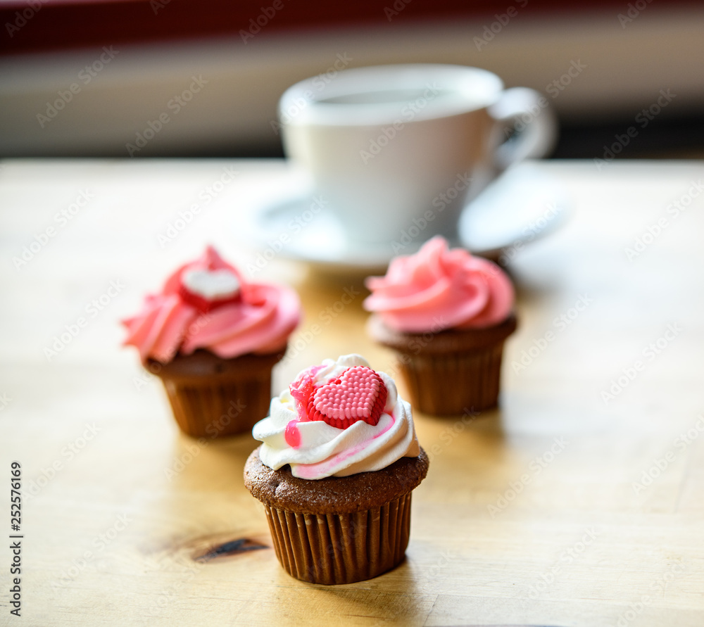 pink and white muffins with heart and coffee cup pink and white muffins with heart and coffee cup