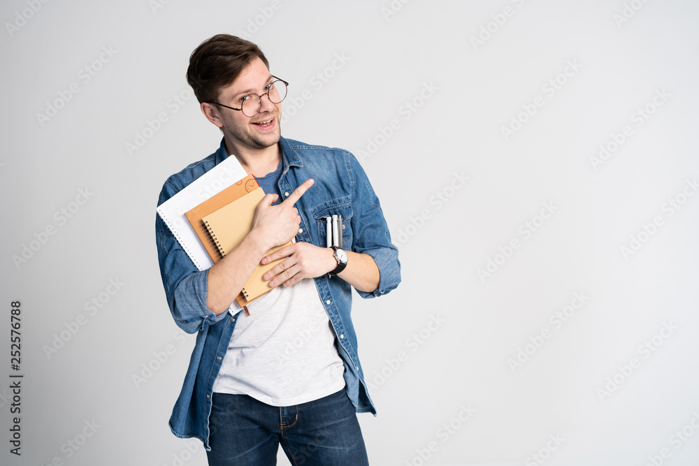 I have got brilliant idea. Caucasian cheerful man, raises index finger, has intriguing plan isolated over white background with copy space