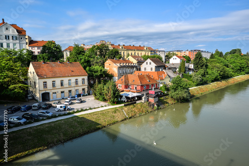 Maribor city, Slovenia. Drava River, buildings and Alps mountains of Maribor.