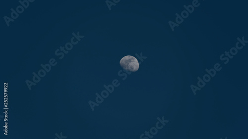 Full Moon in a Clear Blue Daylight in Autumn