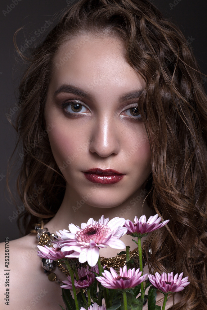 Fototapeta premium Portrait of a beautiful teen girl with creative makeup.