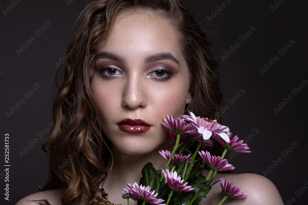 Portrait of a beautiful teen girl with creative makeup.