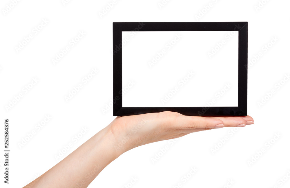 Hand with black wooden frame for photo, copy space template. Hand with black wooden frame for photo, copy space template.