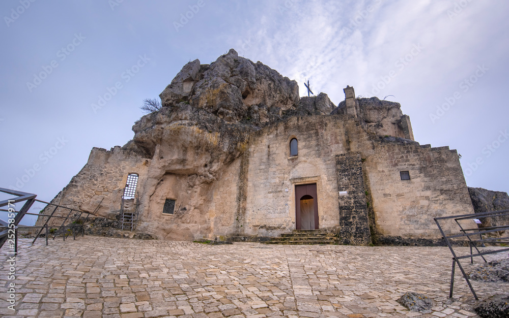 Matera, Basilicata, Puglia, Italy - View of the church of Madonna de Idris (  Chiesa Rupestre di Santa Maria di Idris ) in the rock. Cave church in Sassi old town. Montirone hill