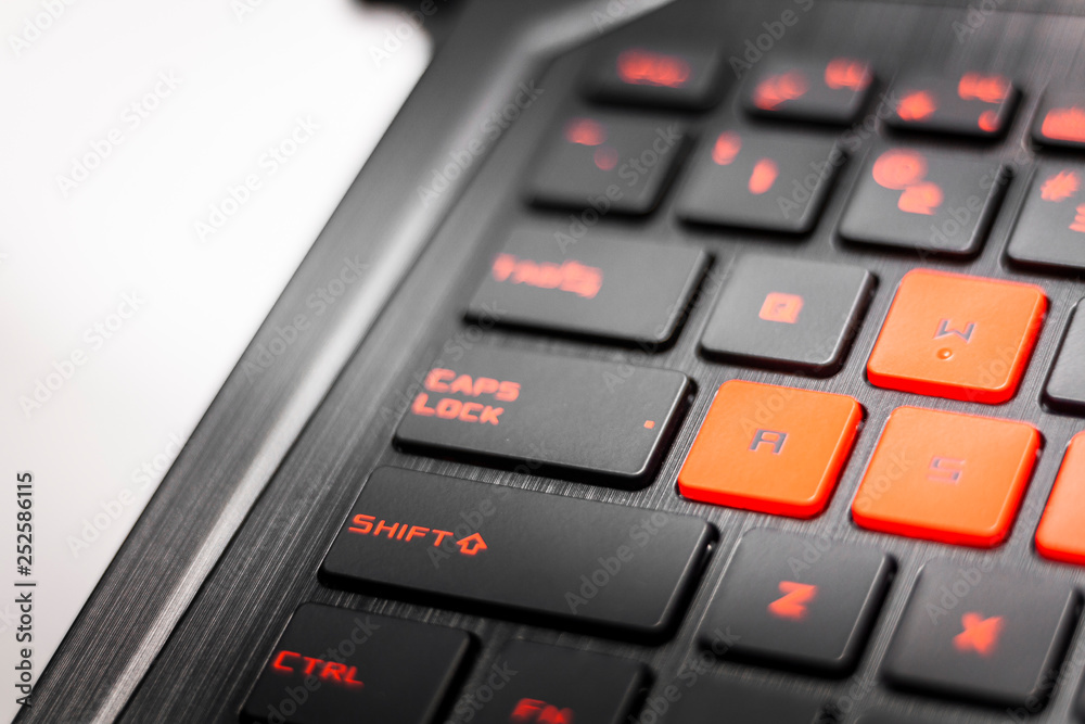 Advance new keyboard for extreme gamers. Black carbon casing, red and orange details. Nerd time concept, hardcore e-sports tools. Advance new keyboard for extreme gamers. Black carbon casing, red and orange details. Nerd time concept, hardcore e-sports tools.