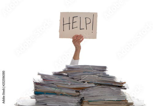 Person under a pile of papers with a hand holding a sign of help. Accounting.