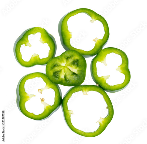 Set of sliced red bell pepper section pieces isolated over white background, view above