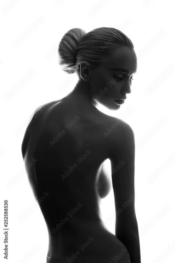 Naked woman with perfect body on white background, isolate. Graceful art Nude girl blonde erotic posing, clean smooth skin, thoughtful look of a woman. Large natural Breasts