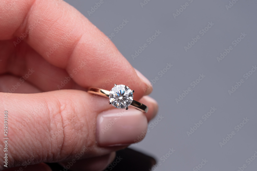 Diamond Engagement Ring Holding in Female Hand