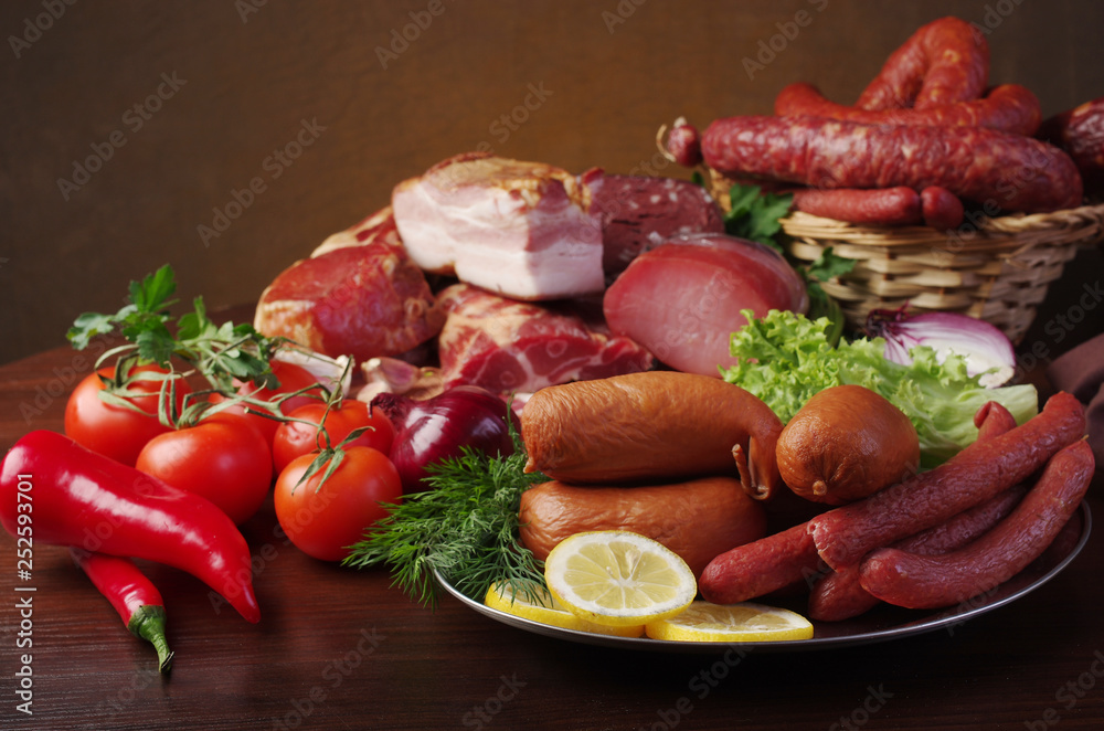 Meat products and vegetables. Ham and sausage, lemon, tomatoes, peppers, lettuce and parsley Meat products and vegetables. Ham and sausage, lemon, tomatoes, peppers, lettuce and parsley