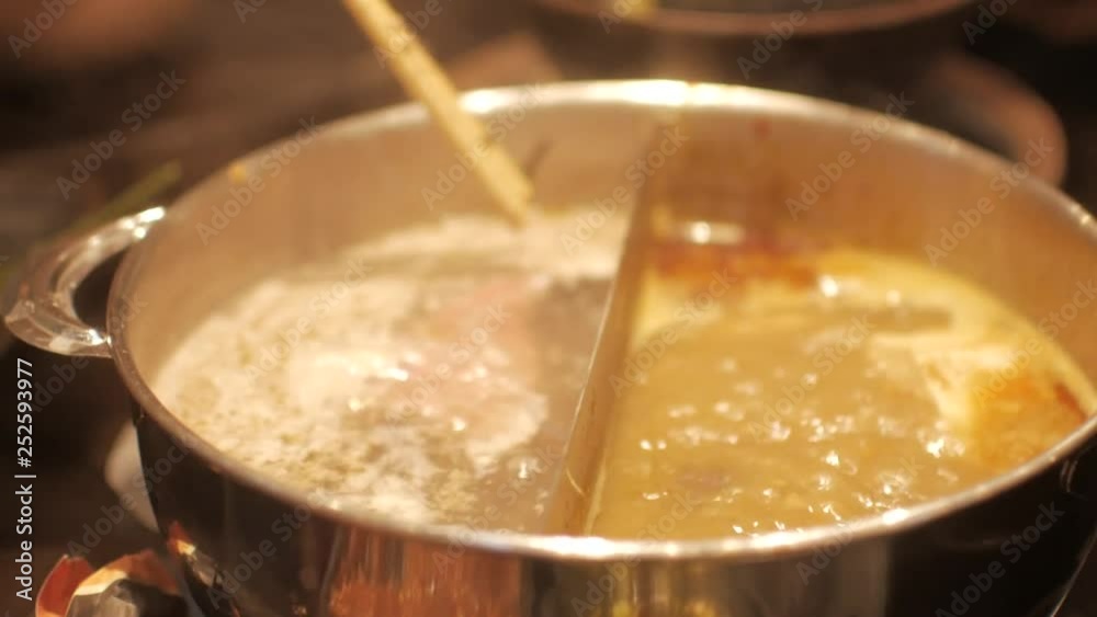 Close up into the shabu shabu pot while boiling -Japanese/Chinese food Close up into the shabu shabu pot while boiling -Japanese/Chinese food