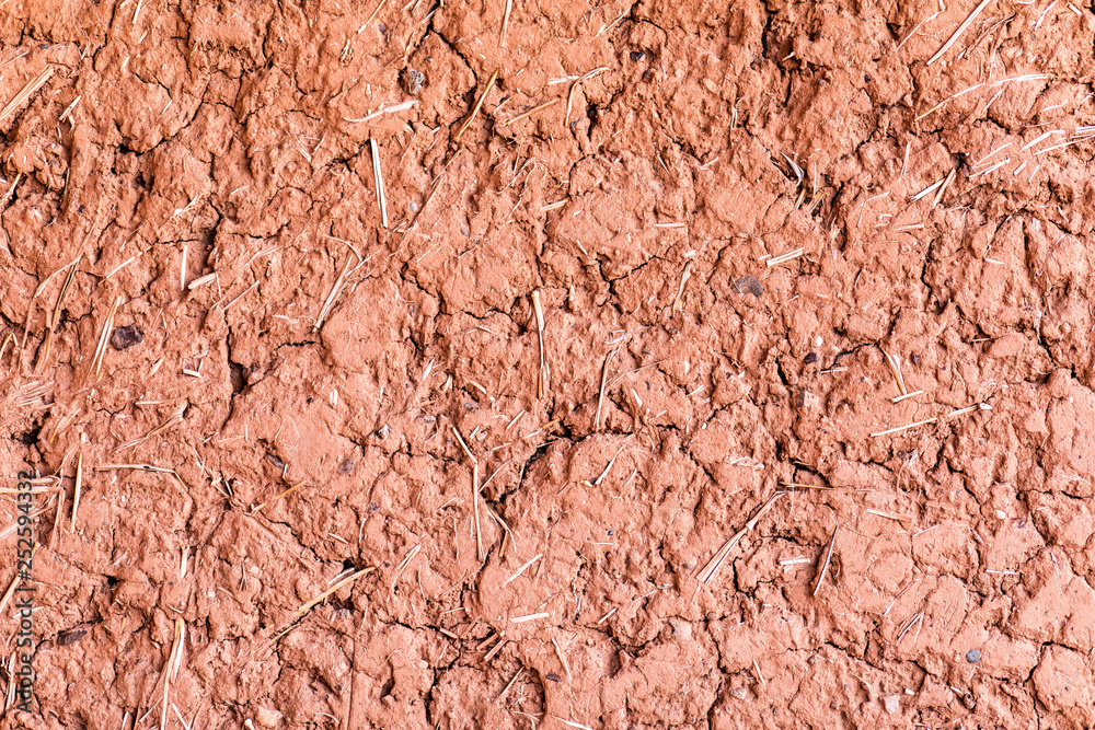 Clay earthen terracotta wall texture background  of traditional house of Morocco.