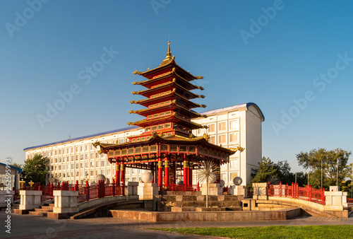 A view of the pagoda of Seven Days with a prayer drum and a mantra  Oh  the pearl shining in the lotus flower   in the Tibetan  Sanskrit and the Kalmyk language on it.