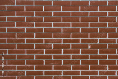 Red brown block brick wall Beautifully arranged texture background
