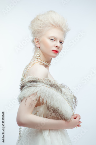 beautiful albino girl with red lips on white background