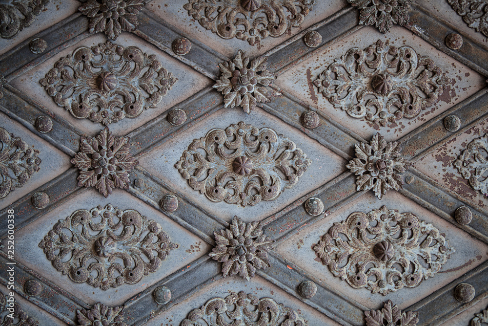 Pattern on an old metal door in Prague