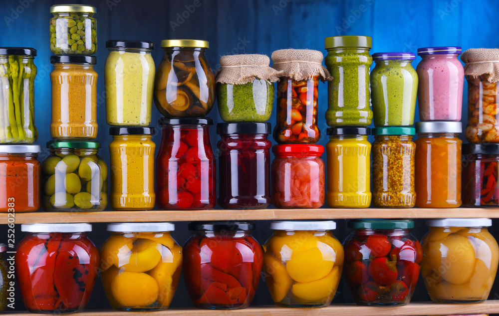 Jars with variety of pickled vegetables and fruits Jars with variety of pickled vegetables and fruits