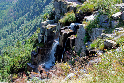 The highest waterfall in National park Giant mountains in Czech republic. photo