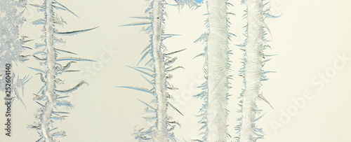 frozen streams of water on glass