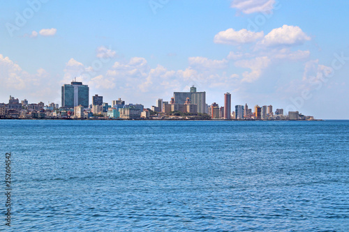 View of the panoramatic Havana in Cuba. There is blue sky and blue ocean