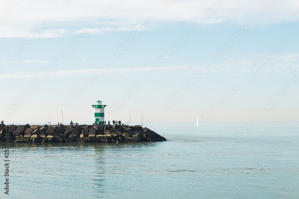 Lighthouse on the sea under sky in the Netherlands