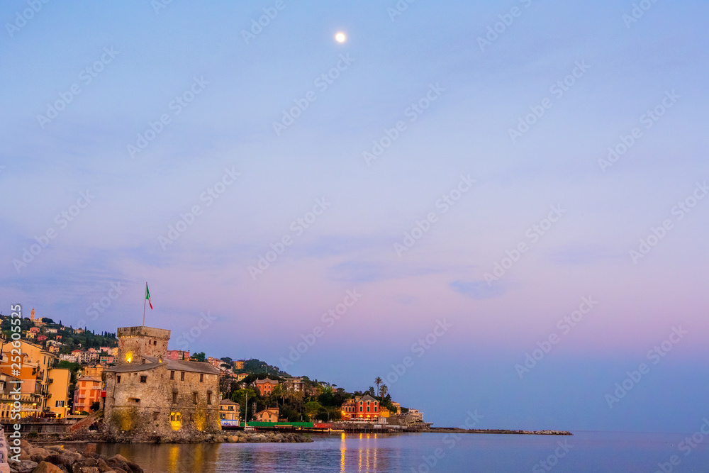 panorama italian sea village space text and moon high in the sky - Rapallo italy sea town copy space background night sunset
