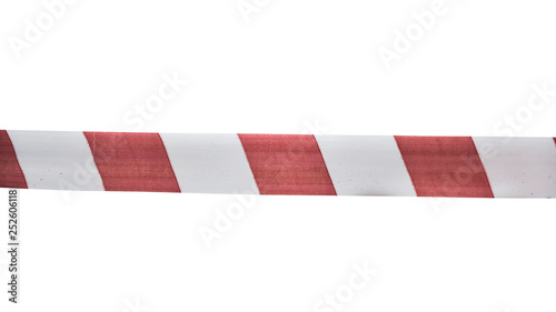 Red white signal tape close up isolated on white. Warning of danger. No entry.