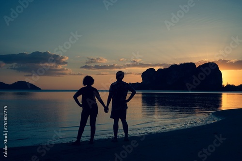 couple on the beach at sunset