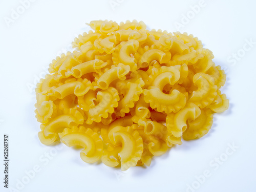 Heap of raw pasta isolated on white background.