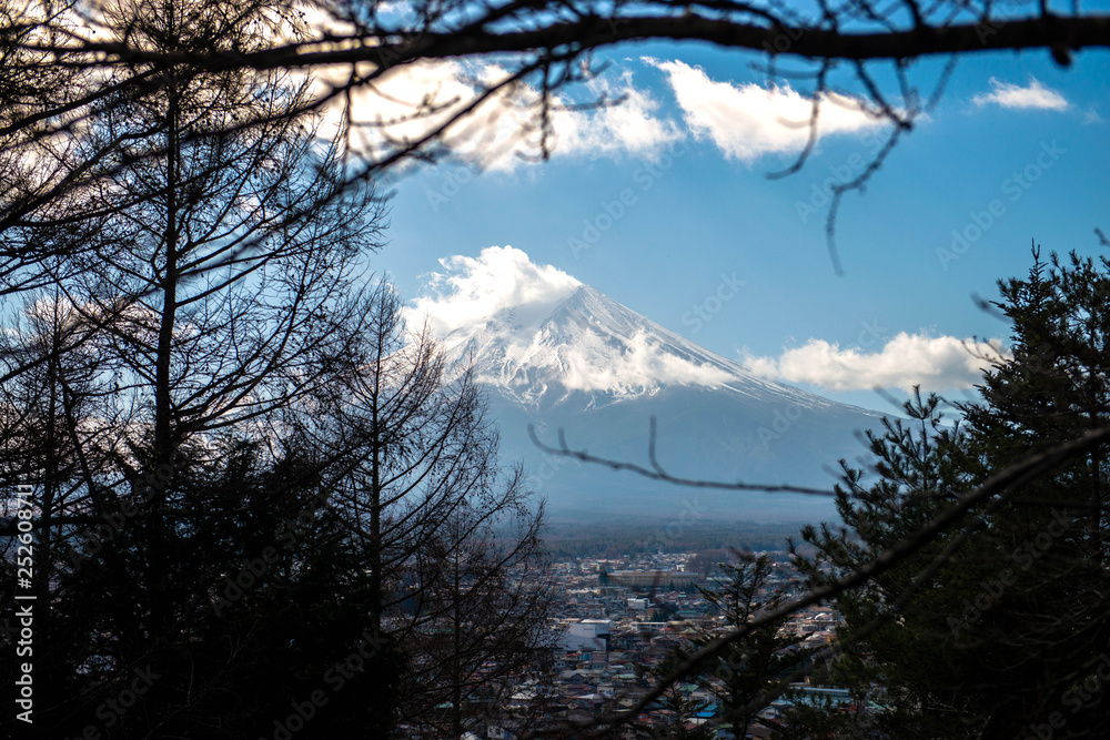 Fuji from the forest on blue sky background with autumn foliage at daytime in Fujikawaguchiko Japan Fuji from the forest on blue sky background with autumn foliage at daytime in Fujikawaguchiko Japan