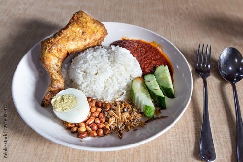 Simple nasi lemak with sambal fried chicken, popular in Malaysia