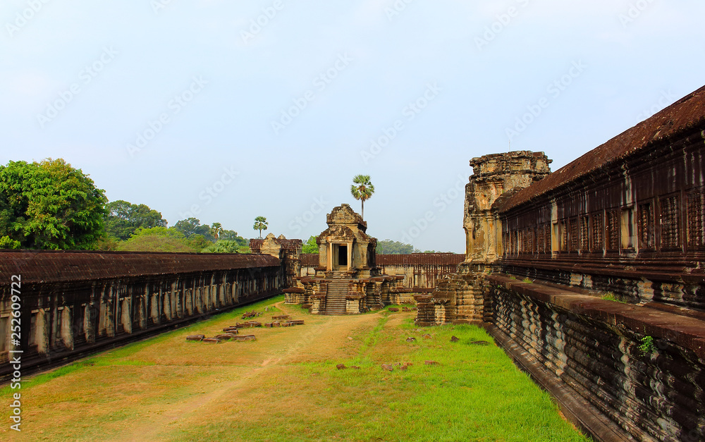 Morning in Angkor Wat temple, Siem Reap, Cambodia. Largest religious monument in the world and popular tourist attraction. Object a UNESCO World Heritage Site. Ancient khmer architecture.