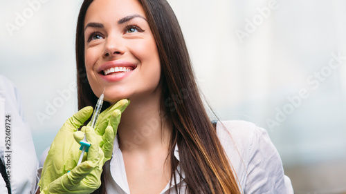 Beautiful young woman gets beauty injection