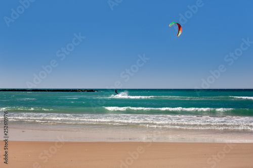 Beach landscape with the kitesurfer as the background