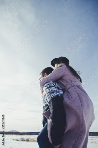 spring walk of a young couple on a Sunny day