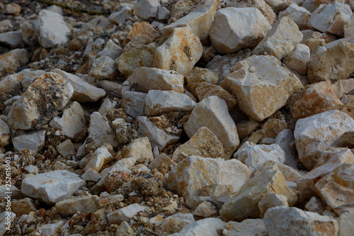 rough pulverized stones on a construction site, broken rock in a heap in different sizes on a construction site
