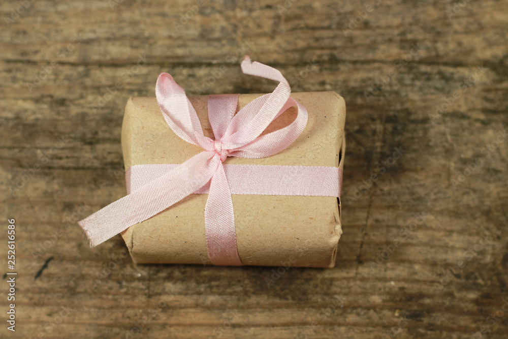 present handmade cosmetics wrapped in papper and flowers present handmade cosmetics wrapped in papper and flowers